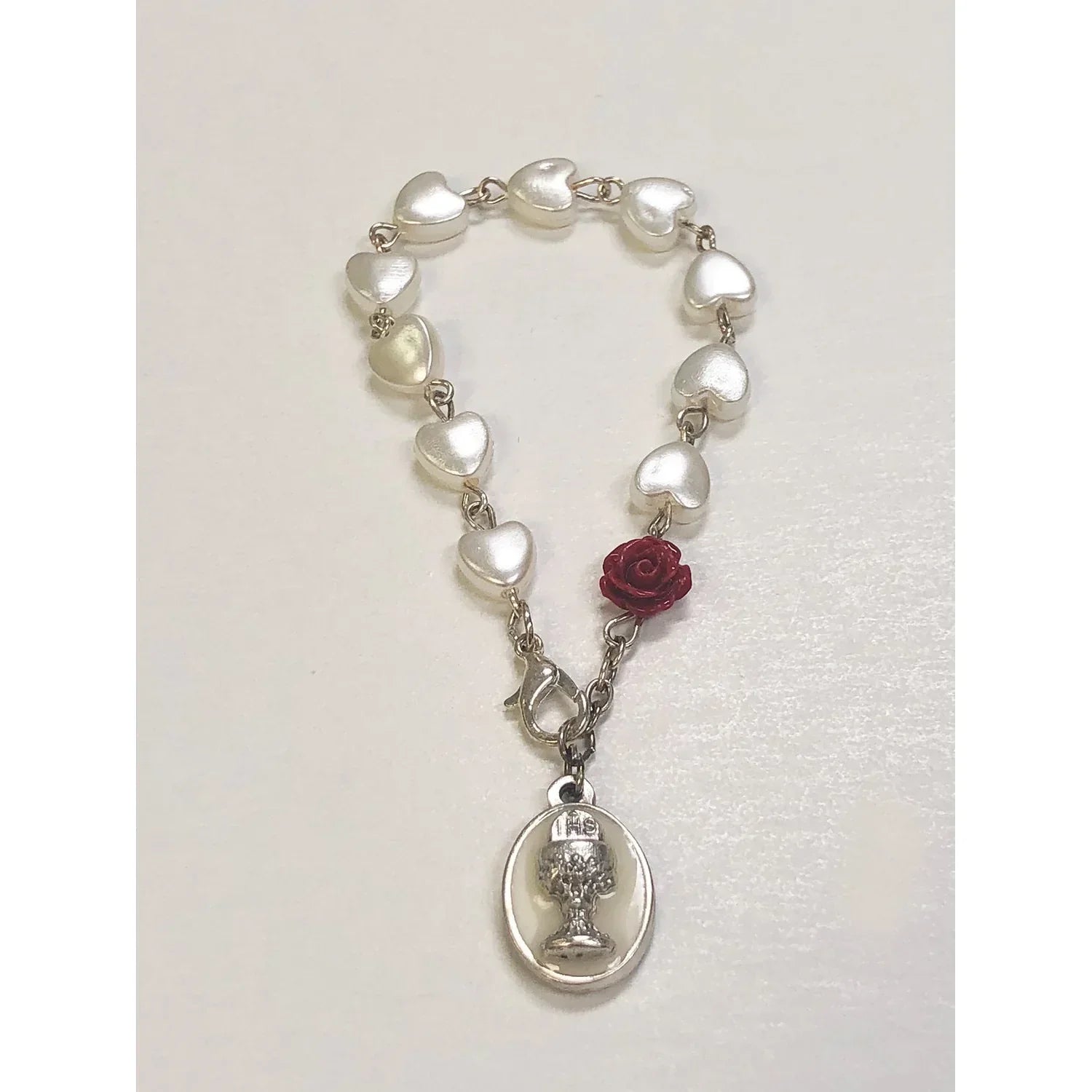 Pulsera de comunión en forma de corazón de perla.