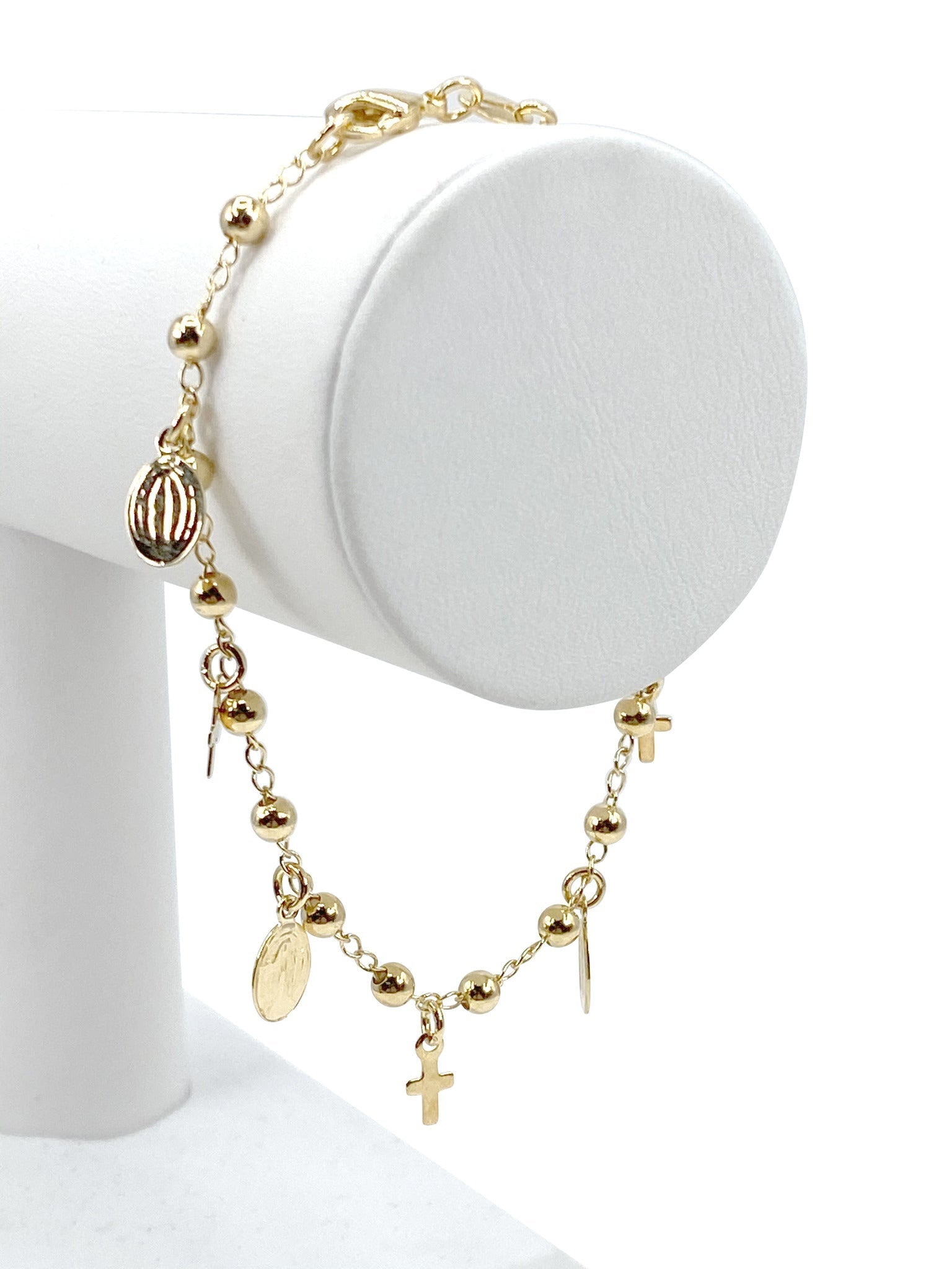 Pulsera con charms de Virgen de Gracia y Cruces