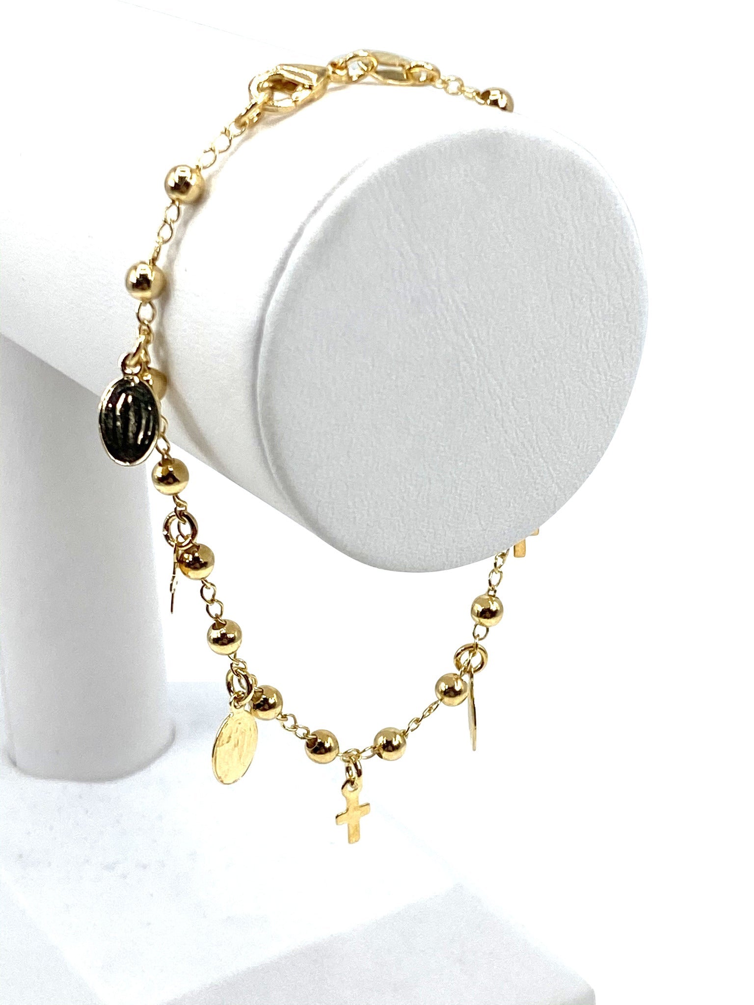 Pulsera con charms de Virgen de Gracia y Cruces