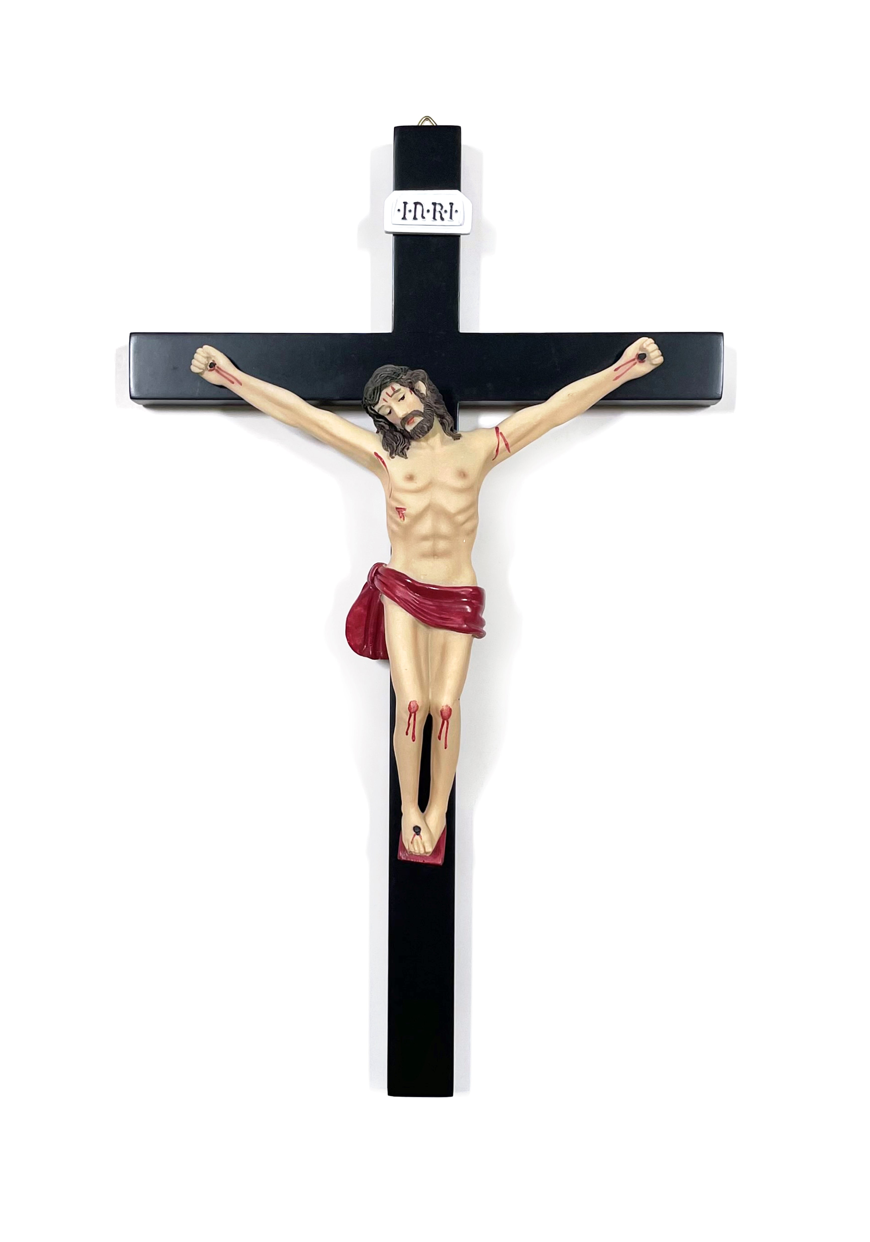 Crucifijo de madera negra con cuerpo de resina.