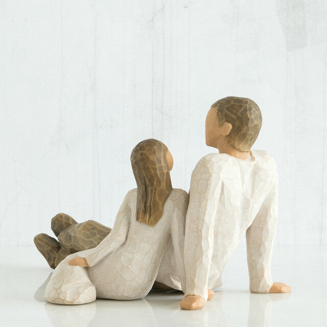 Padre e hija junto a Willow Tree