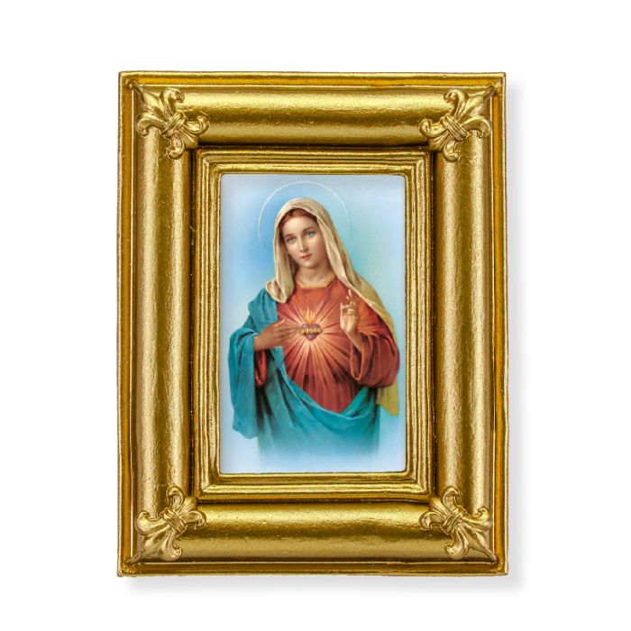 Marco dorado con esquinas de flor de lis y una impresión del Inmaculado Corazón de María.